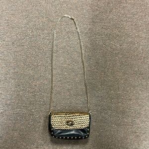 Black purse with fur flap and gold hardware